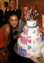 Megan Fox next to Maxim cake